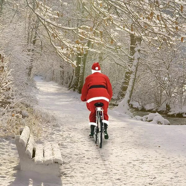 santa cycling through snow